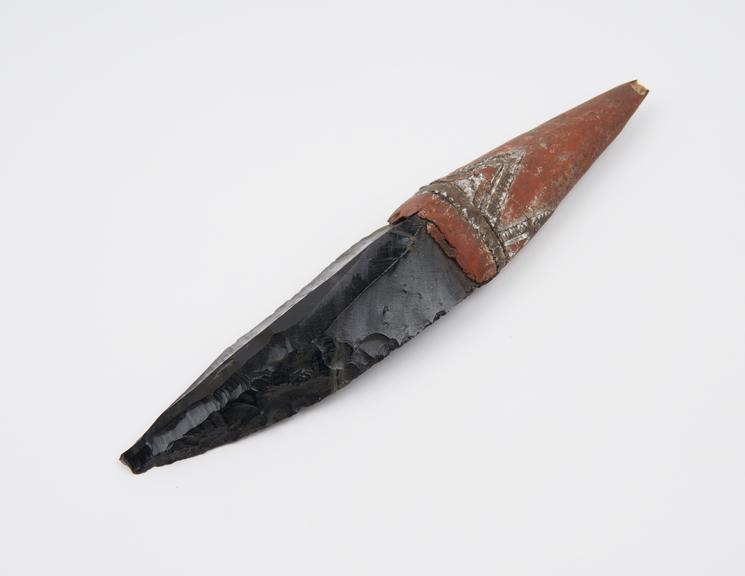 Knife with black obsidian blade and decorated clay handle