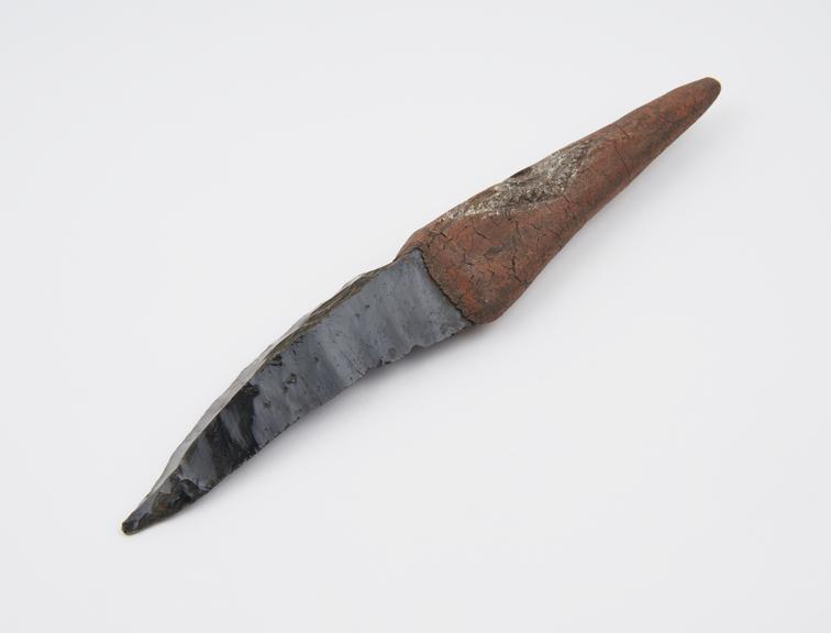 Circumcision knife with black obsidian blade and wooden handle