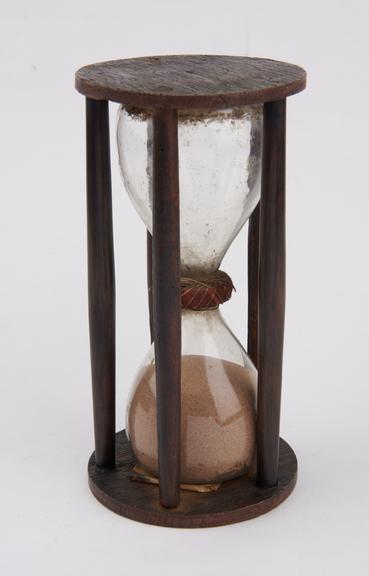 Sand-glass in five pillared wooden mount
