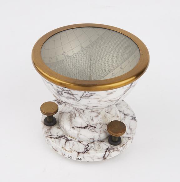 Hemispherical sundial, on porcelain stand with glass cover