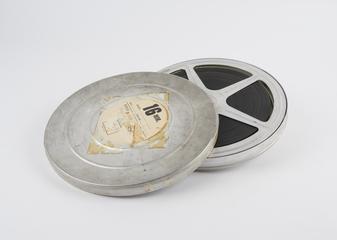 Keystor, reel of 16mm film in lidded tin can
