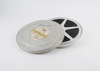 Reel of film in lidded can: 'ICT Opening'