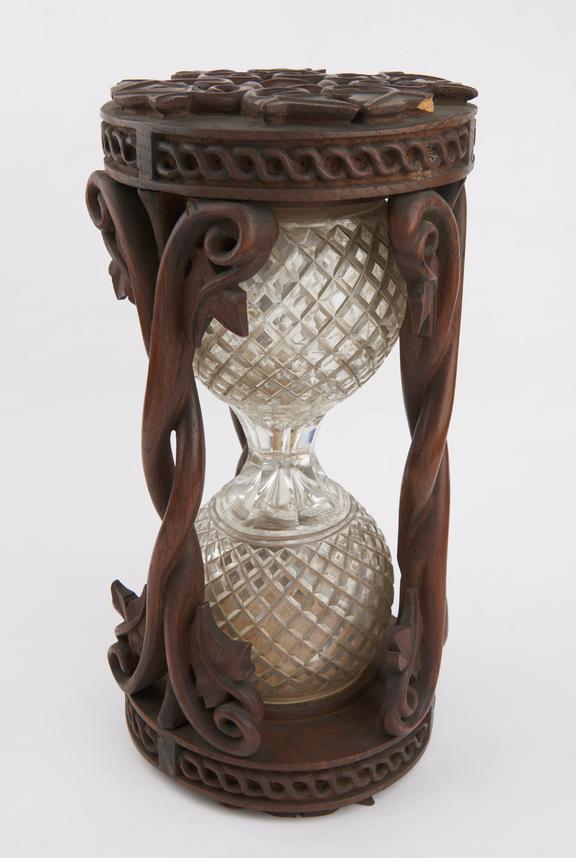 Single sand-glass with cut glass ampoules in ornate three