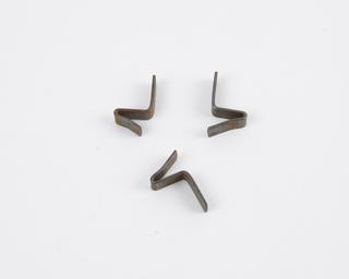 Three metal clips