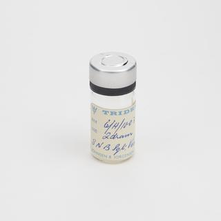 Glass vial with metal lid