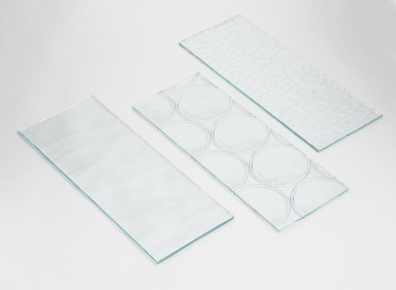 Three of eight pieces of figured glass (white)