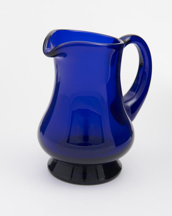 Cream jug in hand made glass in traditional Bristol Blue colour