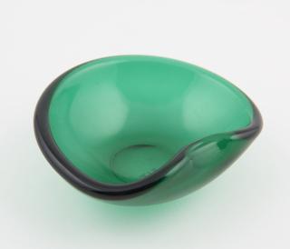 Green ashtray, made by pressing glass