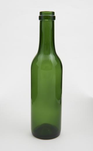 Empty green glass bottle