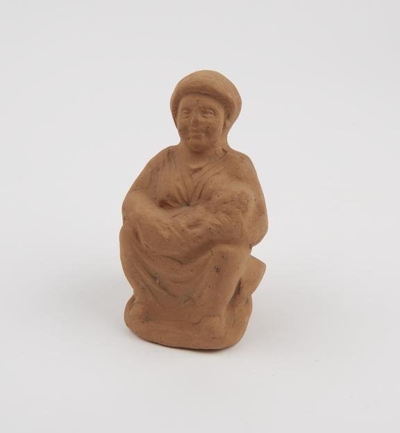 Votive mother and child, mother seated on cushion, terra cotta