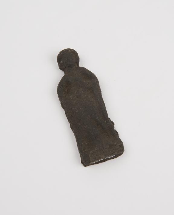 Votive female figure, in black basalt, probably Roman