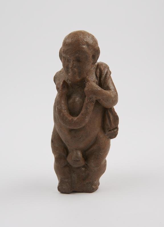 Clay votive figure, depicts obese man holding a snake