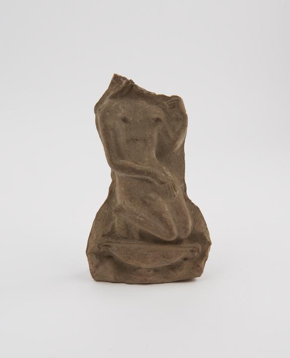 Votive plaque, terracotta, with nude female in relief