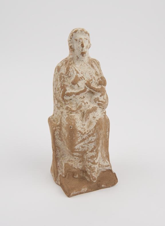 Terracotta votive figurine representing seated female suckling