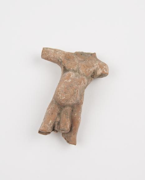 Amuletic terracotta figure androgynous with pregnant belly and male genitalia