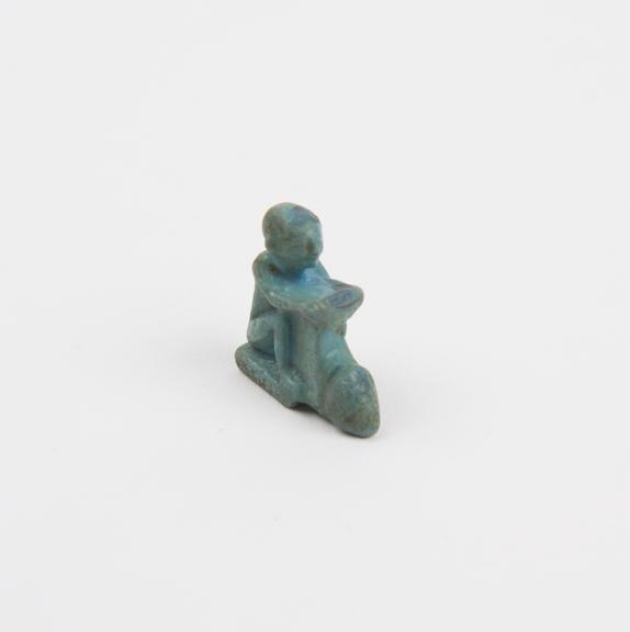 Amuletic figure, blue faience phallic male, probably Egyptian