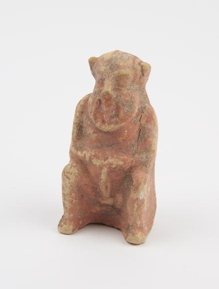 Hollow painted pottery figure of seated ithyphallic satyr