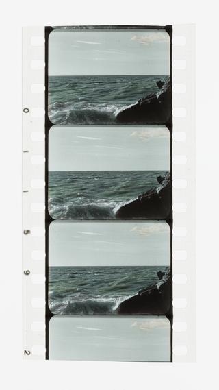 Three full frames and one half frame of 35mm silent stencil colour positive film