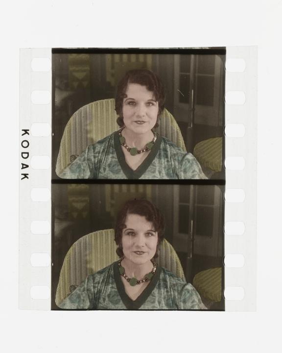 Two frames of silent 35mm stencil colour positive film showing