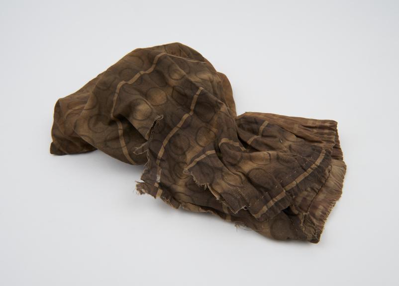 Medicine man's bag, printed cloth containing shells, nut case