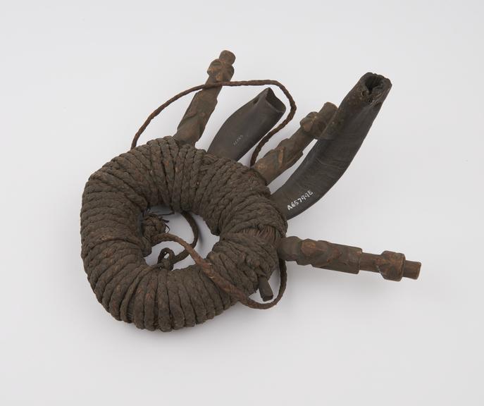 Amuletic grass and fibre ring, closely bound with fibre string