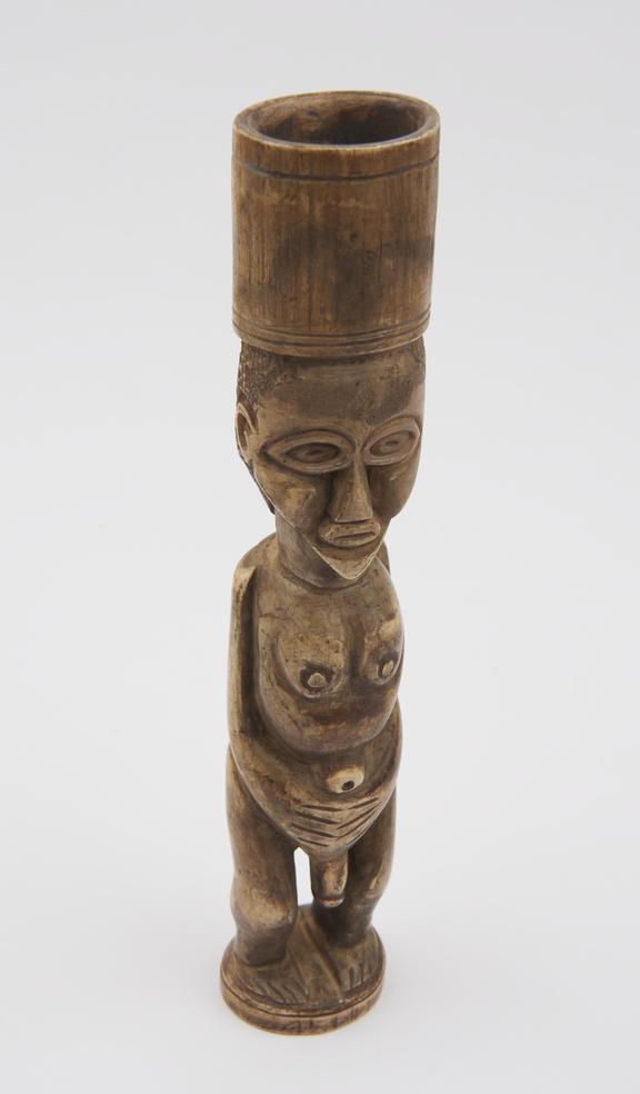 Carved ivory tobacco mortar in the form of a male figure with