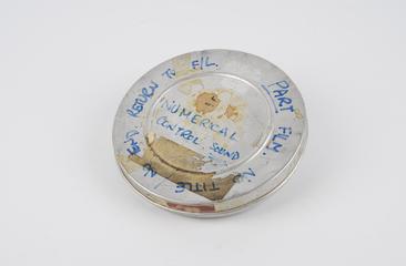 Film canister: Entitled ' Numerical Control '