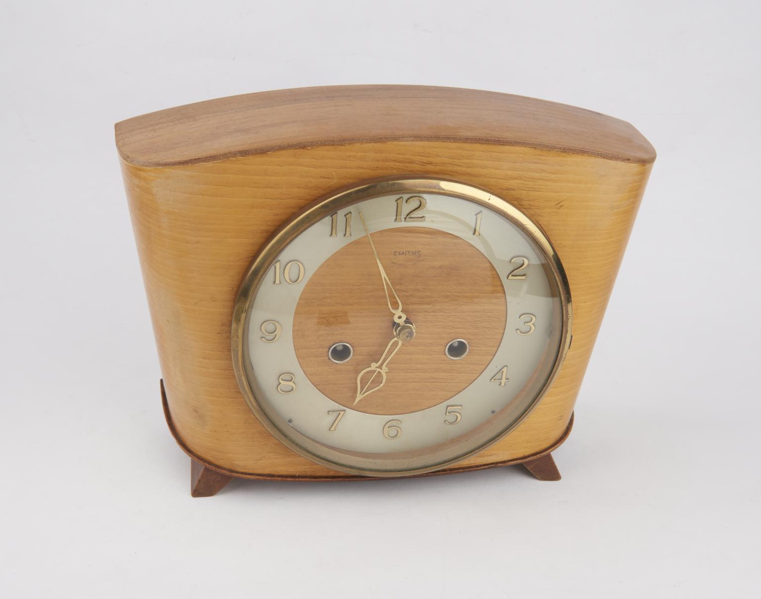 Spring driven floating balance clock