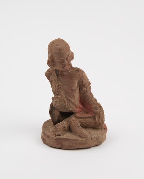 Amuletic terracotta figure of seated androgyne