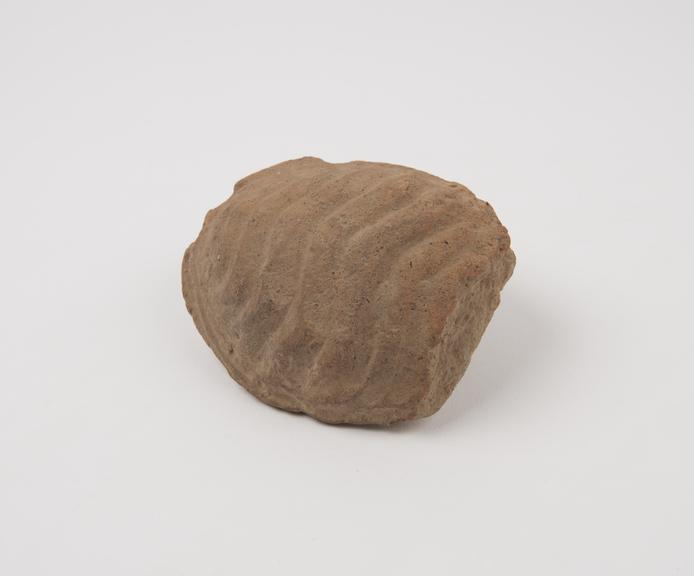 Terracotta votive offering in form of stylised uterus