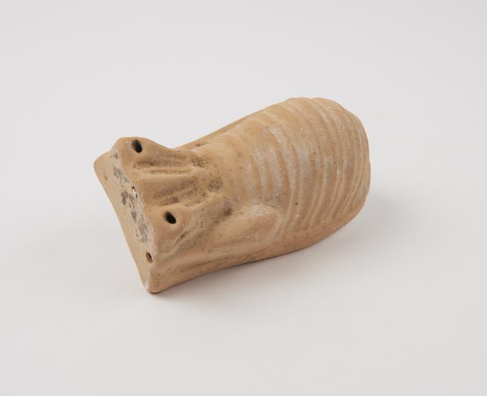 Copy of terracotta votive offering in form of stylised uterus (votive uterus)