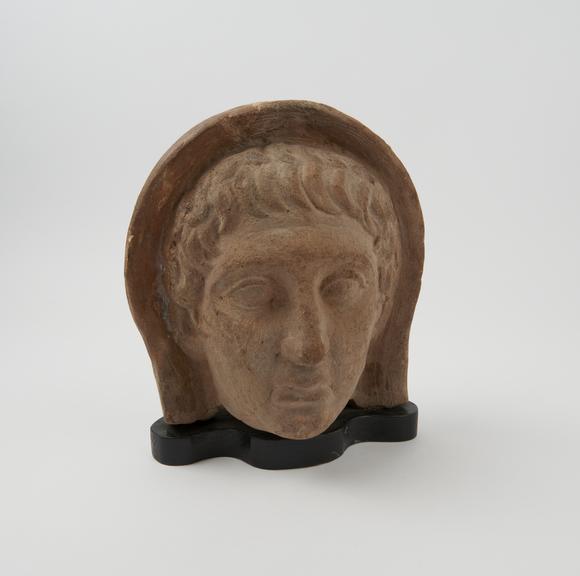 Votive male head, terracotta, Roman, 200BC-200AD