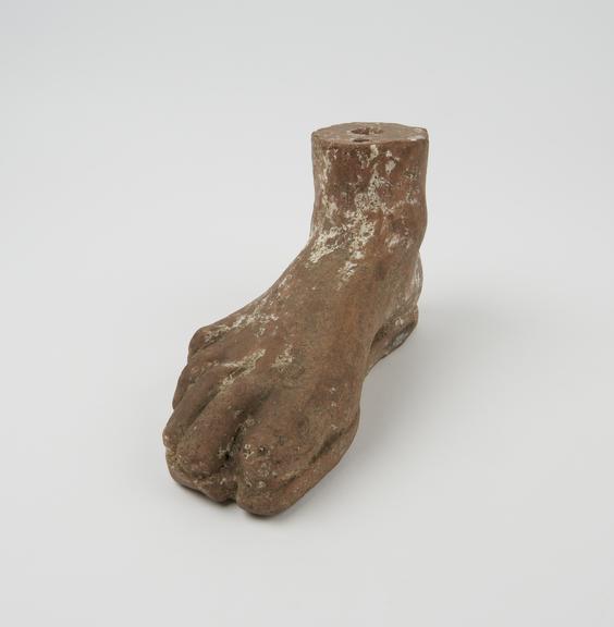 Votive right foot, teracotta, hollow, hole at top and base