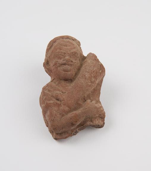 Musician playing stringed instrument, terracotta