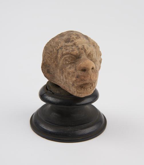 Grotesque head, terracotta, probably Greek