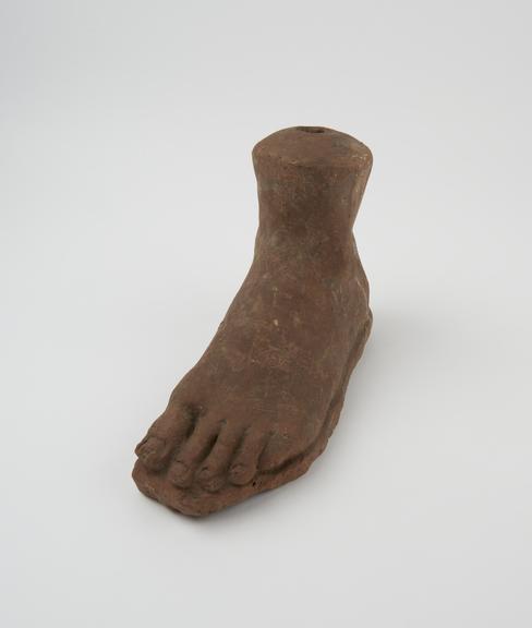 Votive left foot, terracotta, hollow hole at top, without base