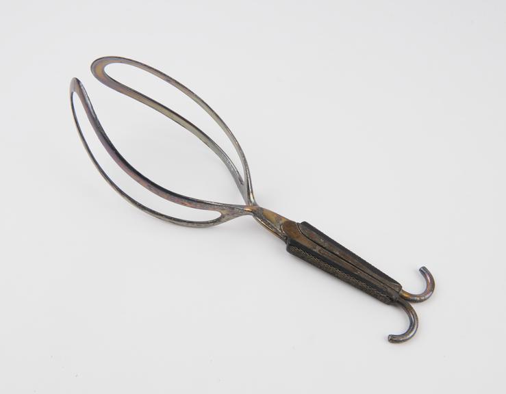 Forceps, obstetrical, metal and ebony, by Ferguson of London