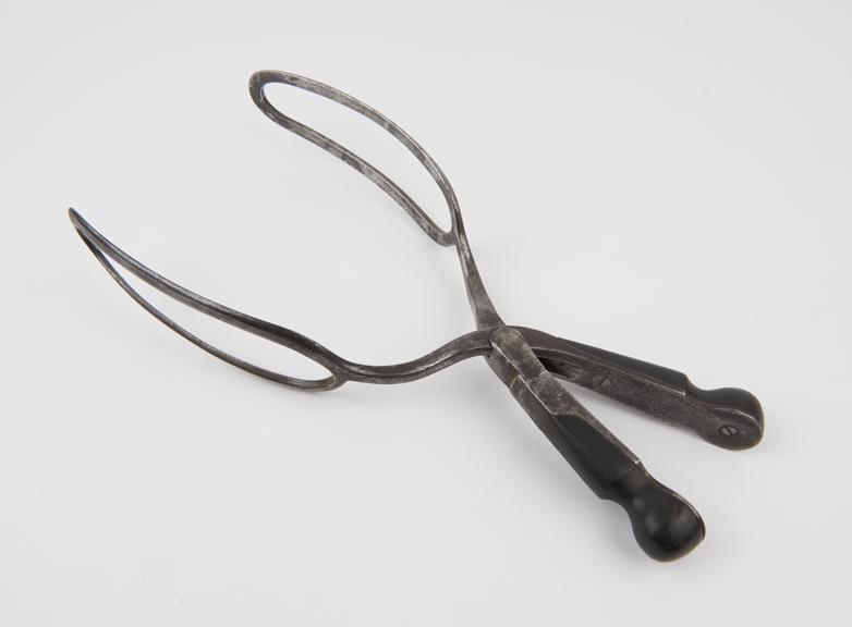 Forceps, obstetrical, Conquest steel and ebony