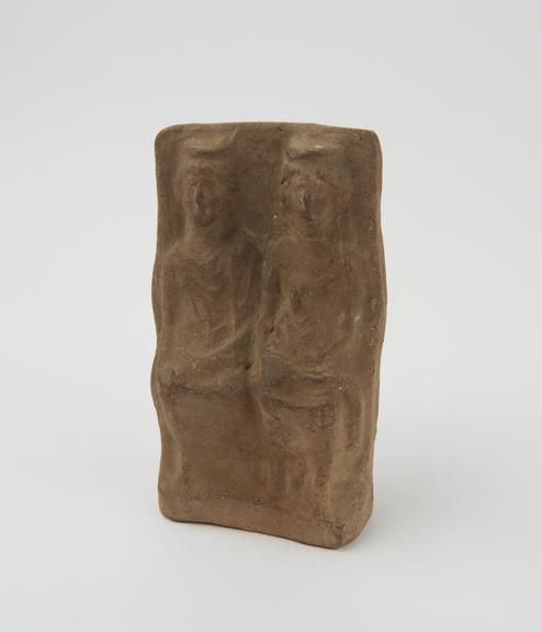 Votive group of man, woman and child, terracotta