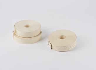 Three white paper rolls associated with the I.C.L. 1901A computer system