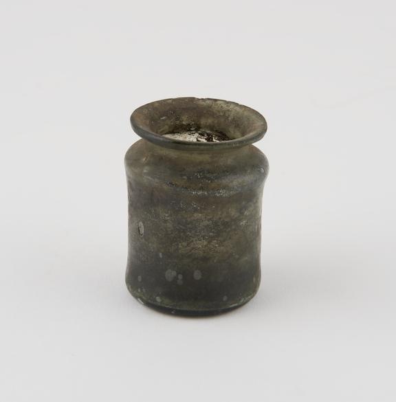 Green glass jar, cylindrical, pontil mark on base, hand moulded