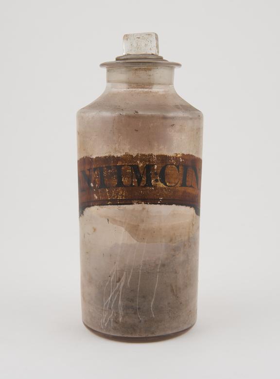 Bottle, clear glass, with contents, for antimony cinnamate