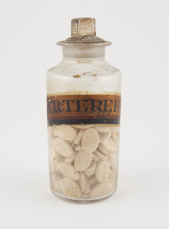 Bottle, clear glass, with contents, for terebenum lozenges