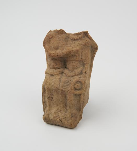 Votive relief of man and woman seated, terracotta, Roman