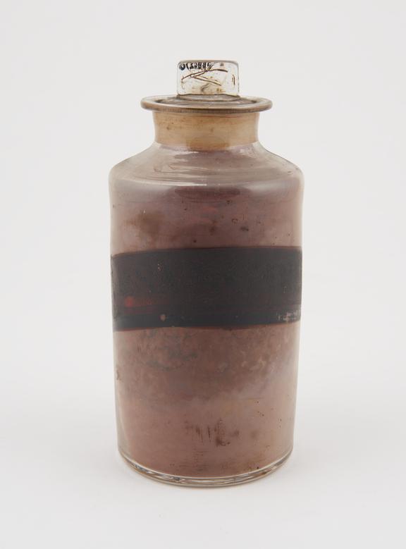 Bottle, clear glass, with contents, for powdered dragon's blood