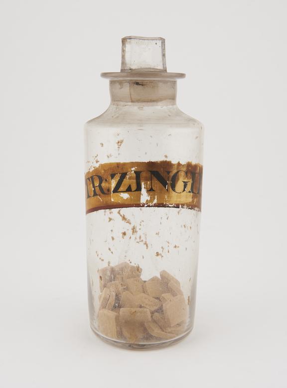 Bottle, clear glass, with contents, for ginger lozenges