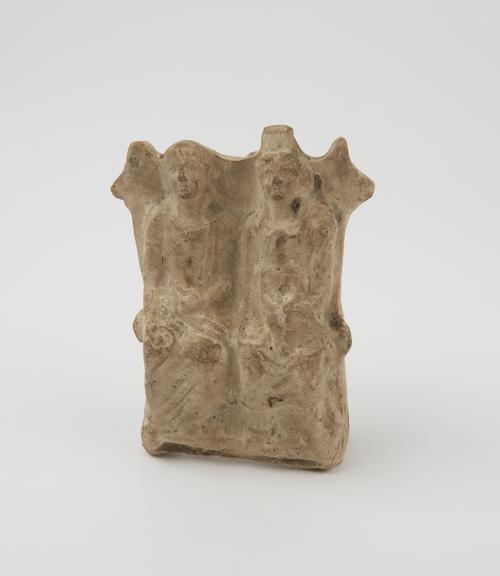 Votive group of male, female and child, terracotta