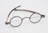 Silver spectacles with round bi-focal lenses