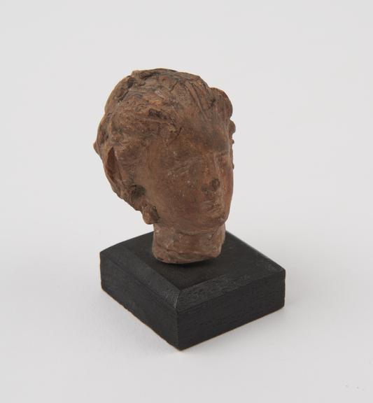 Female head, terracotta, Greek, 300BC-100BC