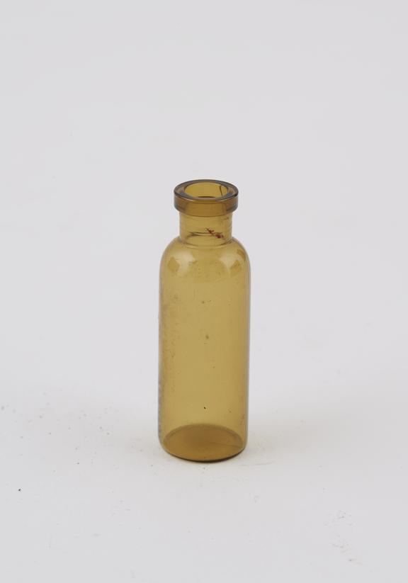 Tiny brown glass bottle, machine moulded, European, 1880-1960